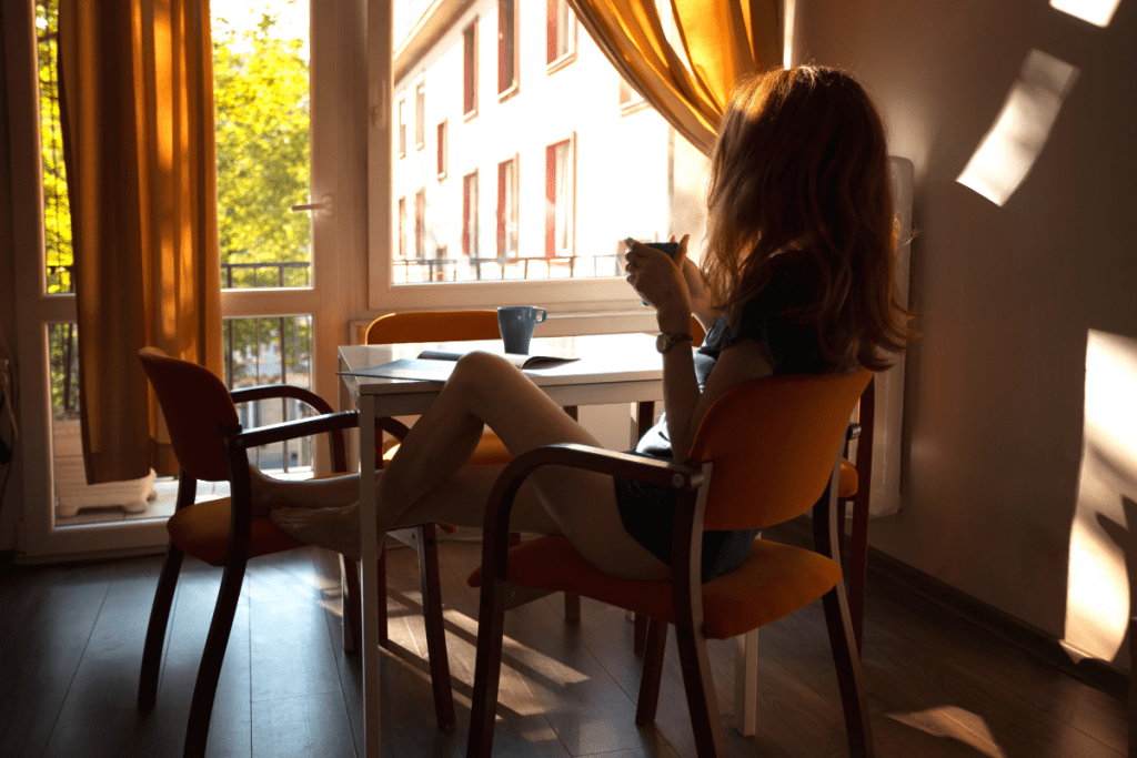 Girl sipping coffee in the morning. An example of simple living